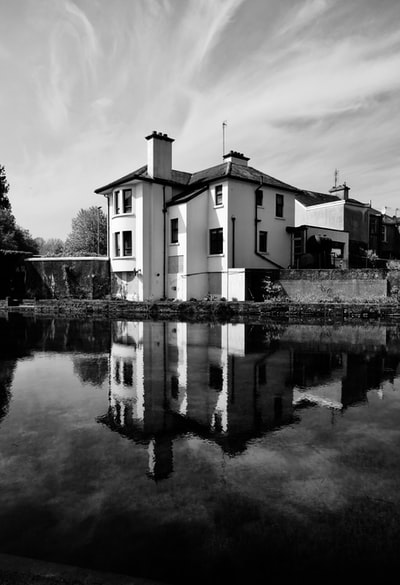 Houses near water grayscale images
